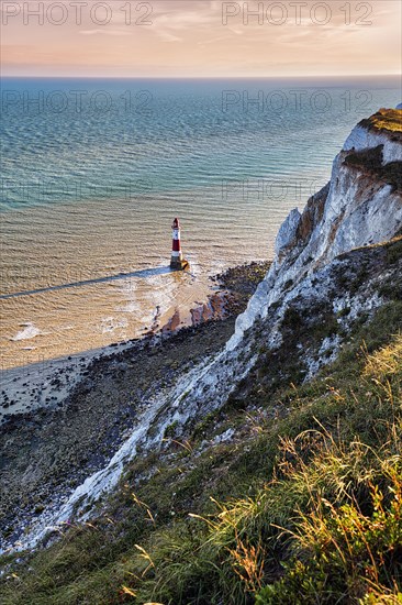 Red and white lighthouse in the sea