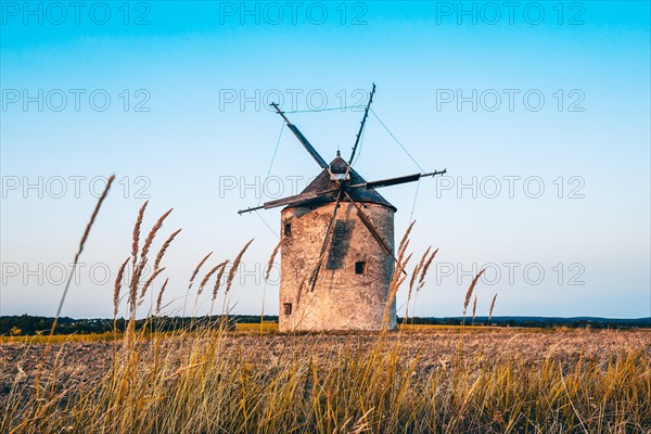 The Old Windmill of Tes in the sunset with guests