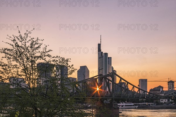 View over the Main River to the skyline of Frankfurt am Main at sunset