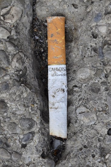 Cigarette butt on stone floor