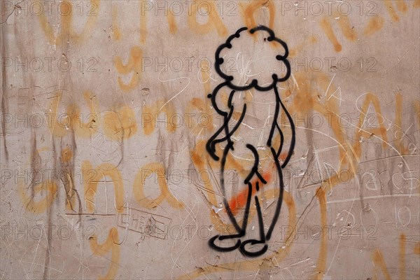Naked woman painted as stick figure on wall