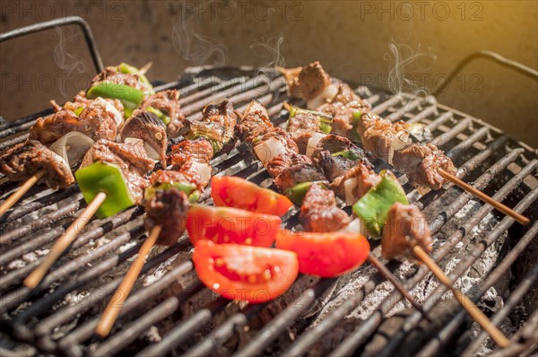 Roast beef skewers on a grill