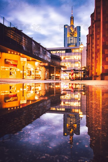 Reflection of the Commerzbank skyscraper or Commerzbank Tower at rain