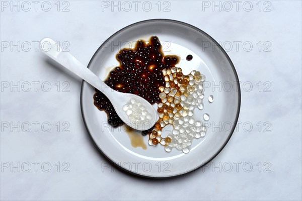 Aceto pearls with spoon in bowl