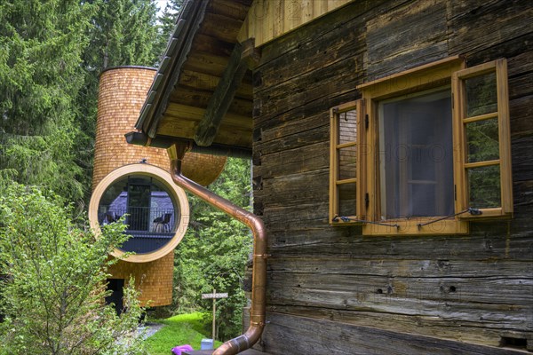 Old wooden house and modern forest house on the Pogusch