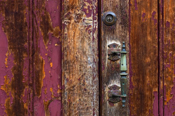 Wooden door with patina and brass handle