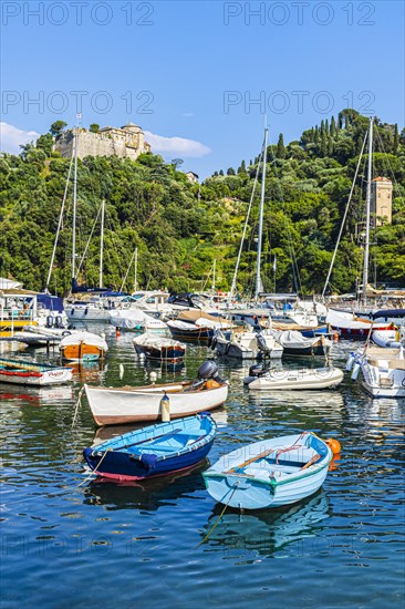Boats and sailing yachts anchored in Portofino harbour