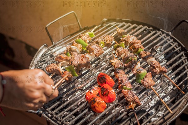 Roast beef skewers on a grill