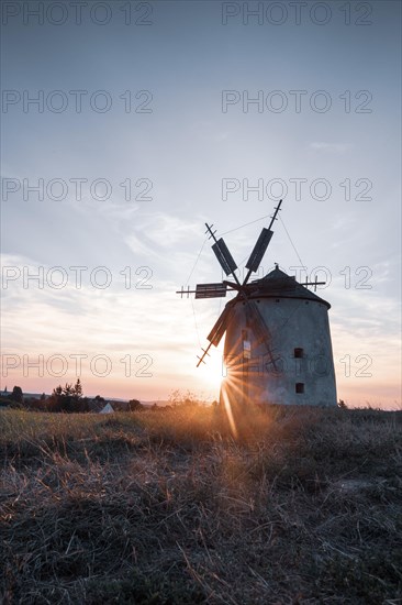 The Old Windmill of Tes in the sunset with guests