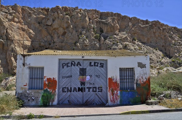 Boat shed with graffiti painted door in Aguilas