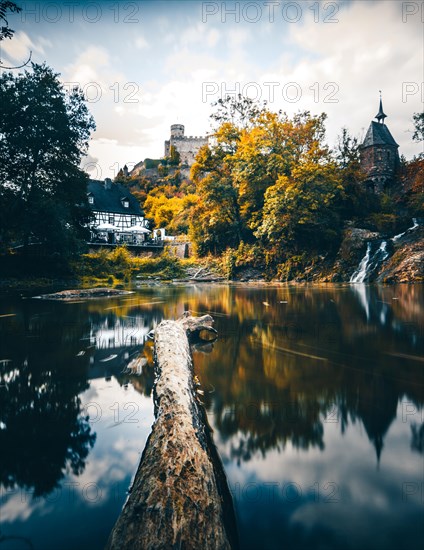 Pyrmonter mill at the waterfall of Elzbach with the castle Pyrmont in the back