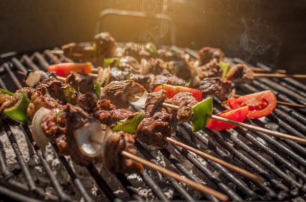 Roast beef skewers on a grill