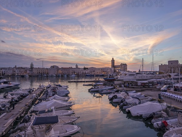 Sunset in the harbour of Trani