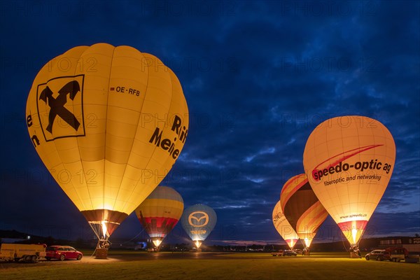 Hot air balloons on the ground during balloon lighting
