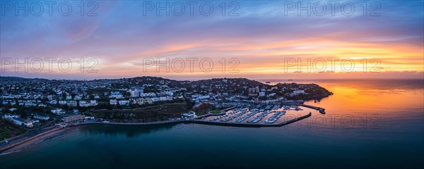 Panorama over Torquay and Torquay Marina from a drone in sunrise time