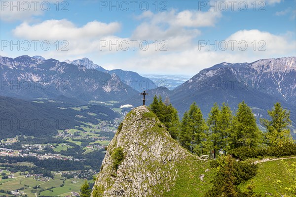 Small summit cross on a mountain peak on the Jenner