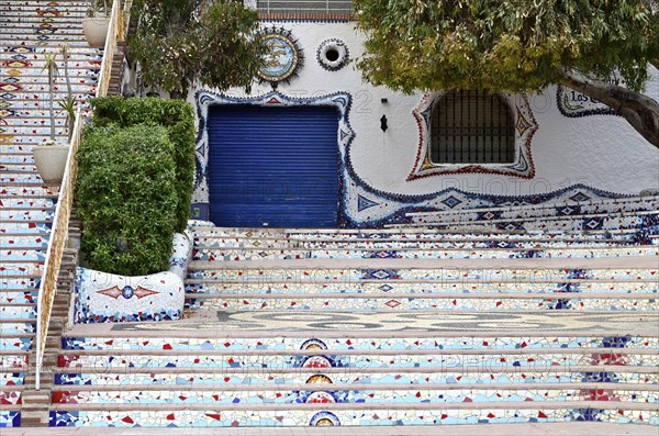 Staircase with mosaics in front of restaurant