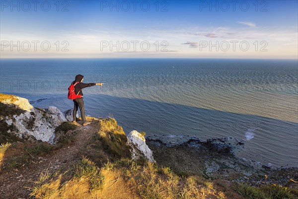 Hikers on cliff top