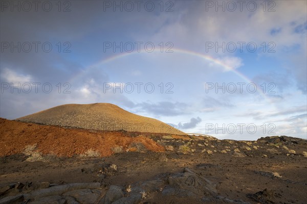 Rainbow and typical volcanic landscape at La Restinga