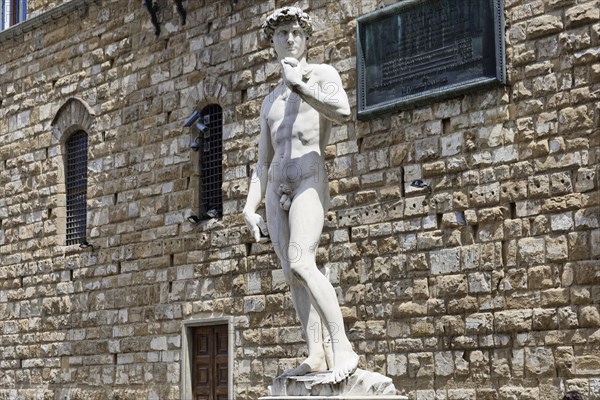 Statue David by Michelangelo in front of the Palazzo Vecchio on the Piazza della Signoria