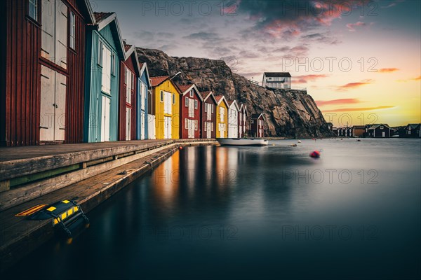 Boats and colourful boathouses in the harbour of Smoegen