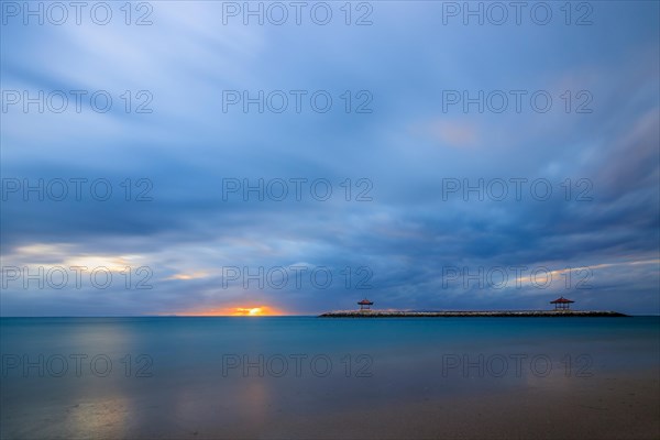 Beach with temple in the water and long exposure at sunrise