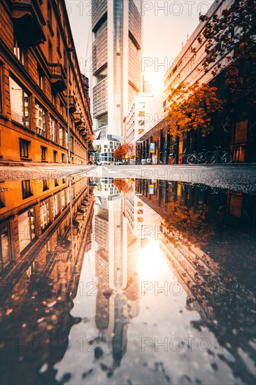 Reflection of the Commerzbank skyscraper or Commerzbank Tower at rain