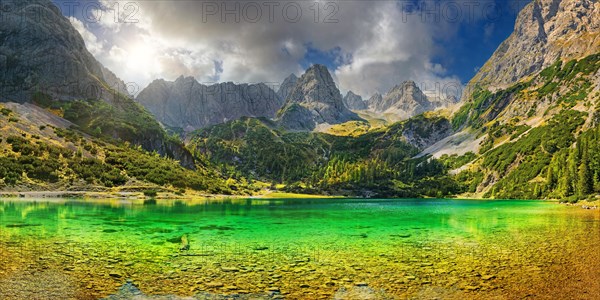 Turquoise Lake Seebensee and the peaks of the Drachenkopf