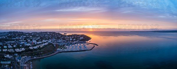 Panorama over Torquay and Torquay Marina from a drone in sunrise time