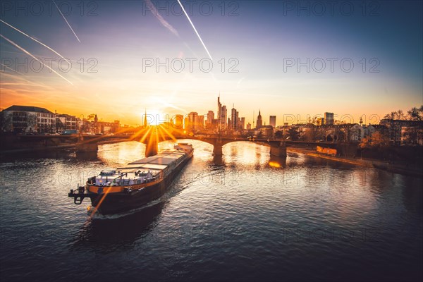 View from the Floeserbruecke over the river Main with container ship