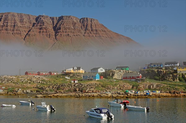 Cloud wall and some multicoloured wooden houses