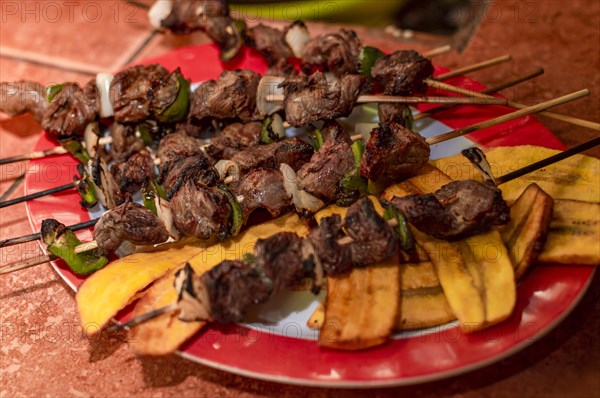 Roast beef skewers served on a silver