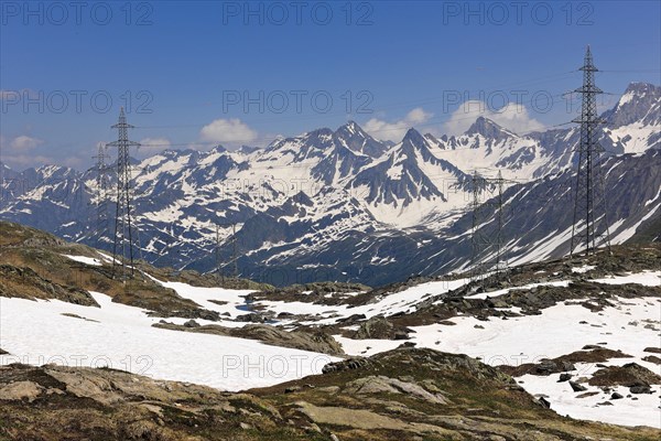 View of power pylons overhead power lines power supply in high mountains