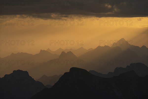 Sunrise with clouds over Allgaeu mountains