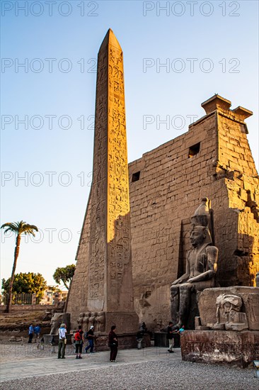 Entrance pylon flanked by two colossal statues of Ramses and obelisk