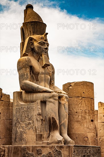 South doorway to the Great Colonnade with colossal statues of Ramses II. Luxor Temple