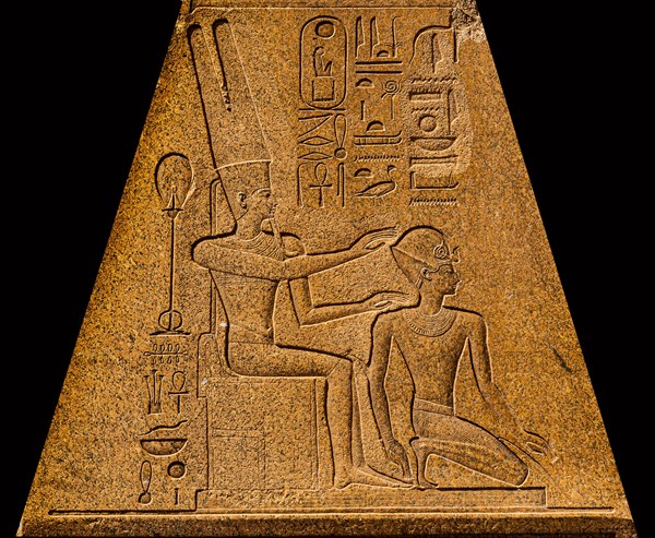 Hatshepsut kneels in front of Amun-Re