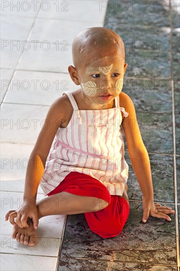 Boy with face painting with Tanaka paste