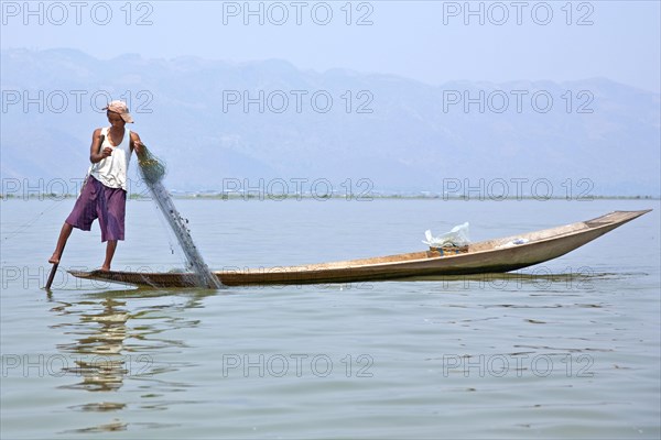 Fishermen with fish trap and nets