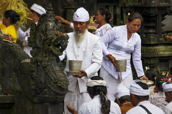 Devout Hindus at a ceremony in the temple