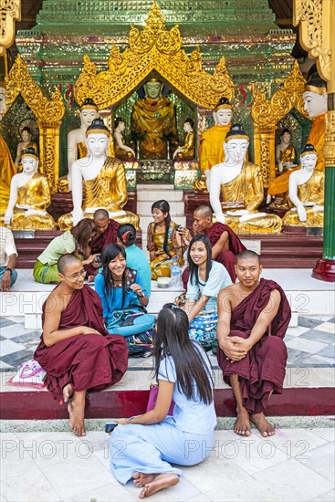 Resting in front of Buddha statues in shrine