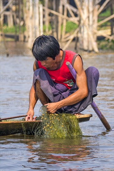 Fishermen with fish trap and nets