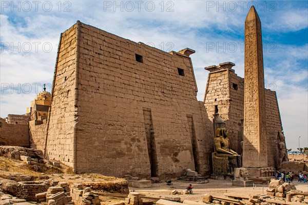 Entrance pylon flanked by two colossal statues of Ramses and obelisk