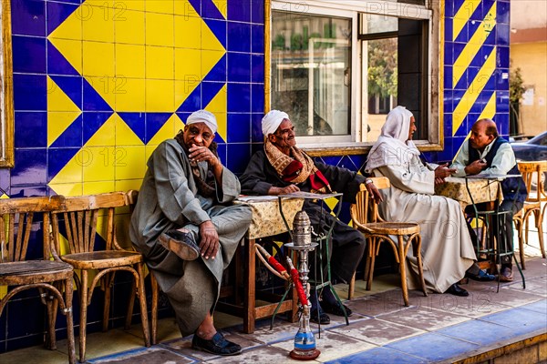 Men smoking hookah