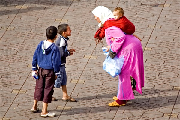 Traditionally dressed woman on the Jemaa El-Fna