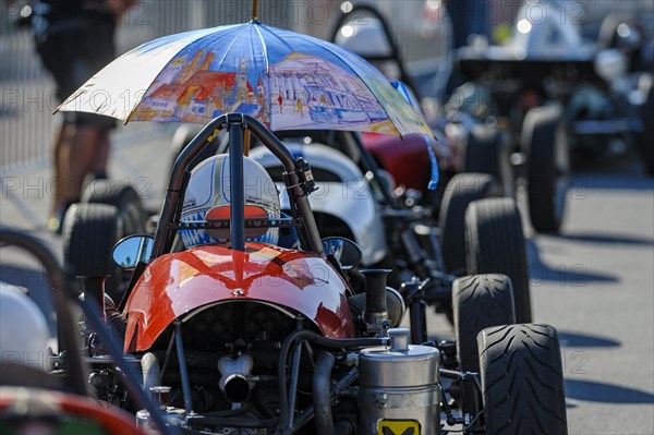 Historic race cars in waiting position