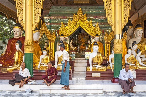 Resting in front of Buddha statues in shrine