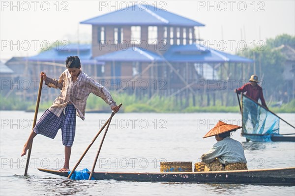 Fishermen with fish trap and nets