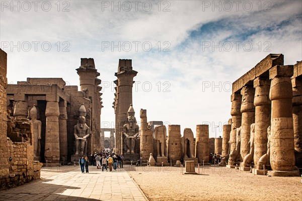 South doorway to the Great Colonnade with colossal statues of Ramses II. Luxor Temple