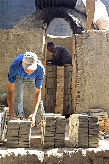 Potters layer the kiln